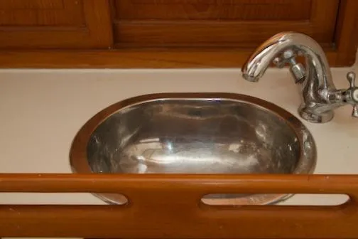 Slide: The Image of Stainless steel sink with faucet in 1986 Passport 42 model kitchen. - 30