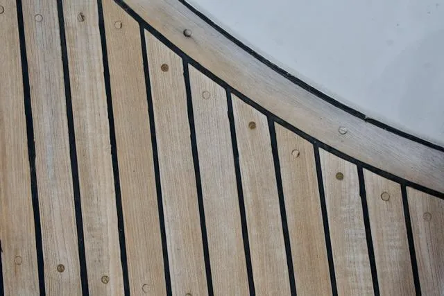 Slide: The Image of Wooden deck with curved design on a 1986 Passport 42 yacht. - 35