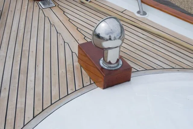 Slide: The Image of Teak deck detail of 1986 Passport 42 yacht with polished metal fitting. - 8