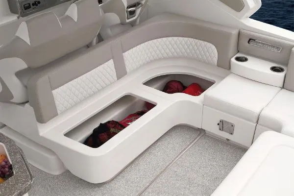 Slide: The Image of 2011 Chaparral 330 Signature boat bathroom with sink, toilet, and mirror. - 16