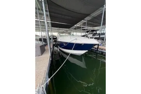 Slide: The Image of Luxurious interior of a 2011 Chaparral 330 Signature yacht with cozy seating and modern amenities. - 6