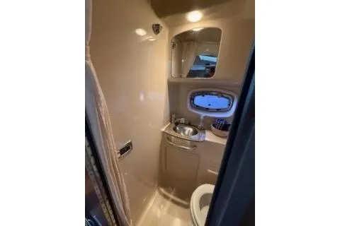 Slide: The Image of Luxurious interior of 2011 Chaparral 330 Signature yacht with cozy seating and elegant wood finishes. - 8