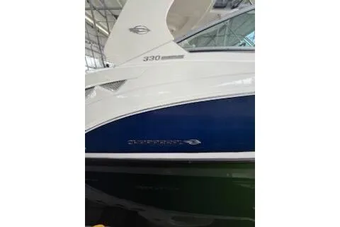 Slide: The Image of Luxurious interior of 2011 Chaparral 330 Signature boat with cozy seating and elegant wood finishes. - 9