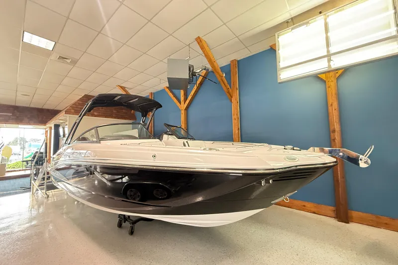 The Image of 2025 Monterey M-65 boat displayed indoors, showcasing sleek design and modern features. - 1