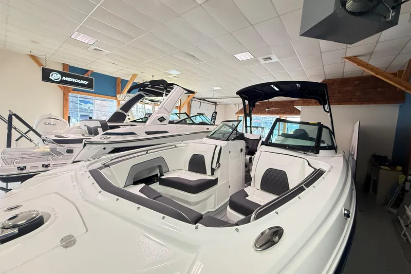 Slide: The Image of 2025 Monterey M-65 boat displayed in showroom with sleek design and modern features. - 3