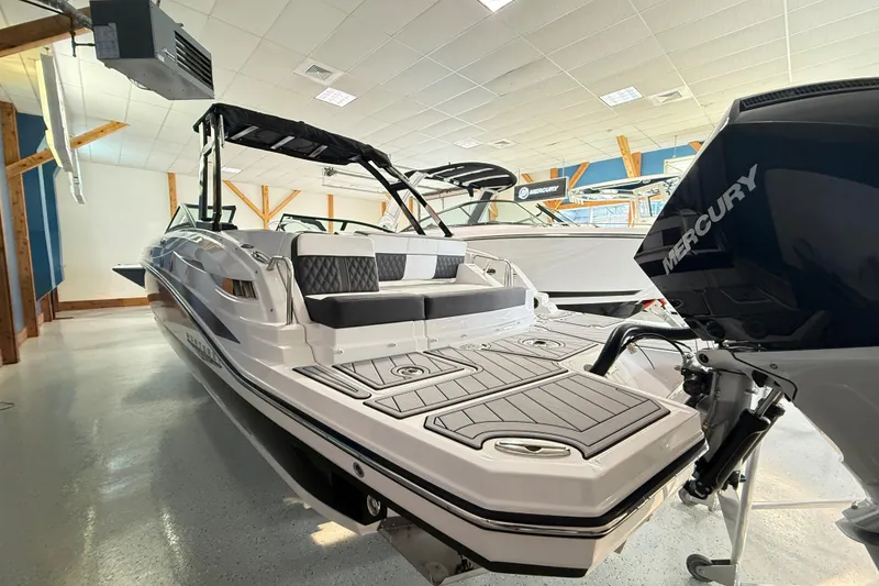 Slide: The Image of 2025 Monterey M-65 boat with Mercury engine displayed in showroom. - 4