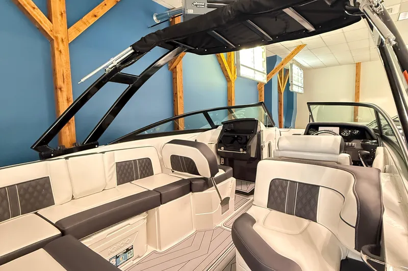 Slide: The Image of 2025 Monterey M-65 boat interior with modern seating and sleek design. - 8