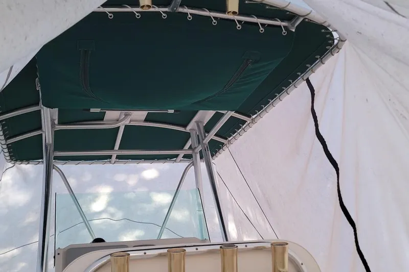 Slide: The Image of Hour meter on 2001 Pursuit 2470 Center Console, showing 613.0 hours elapsed. - 14