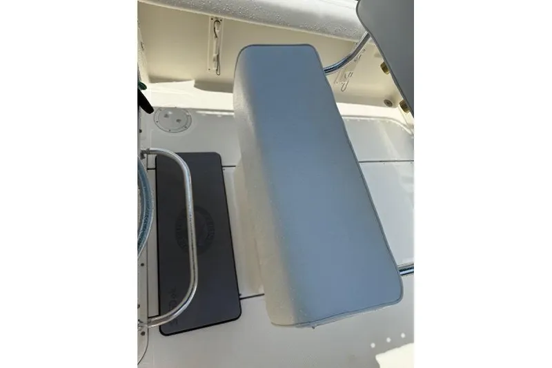 Slide: The Image of 2001 Pursuit 2470 Center Console boat seat and deck view. - 27