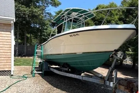 Slide: The Image of Garmin navigation displays on 2001 Pursuit 2470 Center Console boat dashboard. - 5