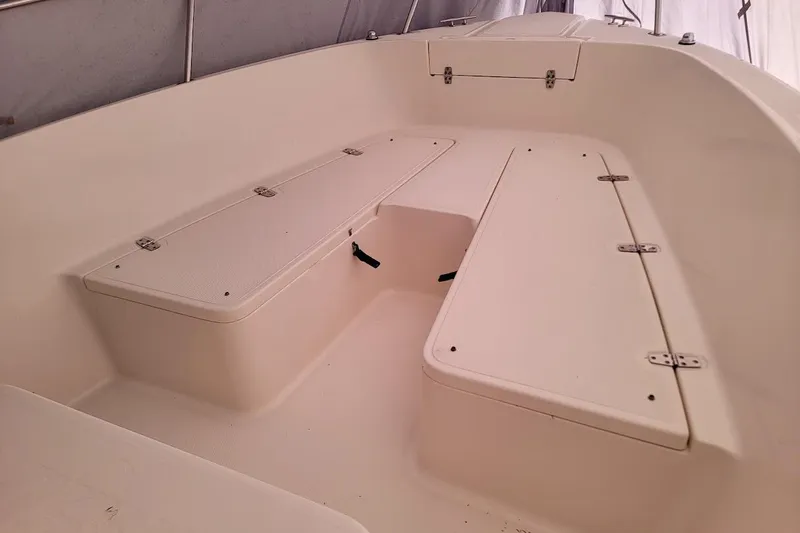 Slide: The Image of 2001 Pursuit 2470 Center Console dashboard with Garmin electronics and communication devices. - 9