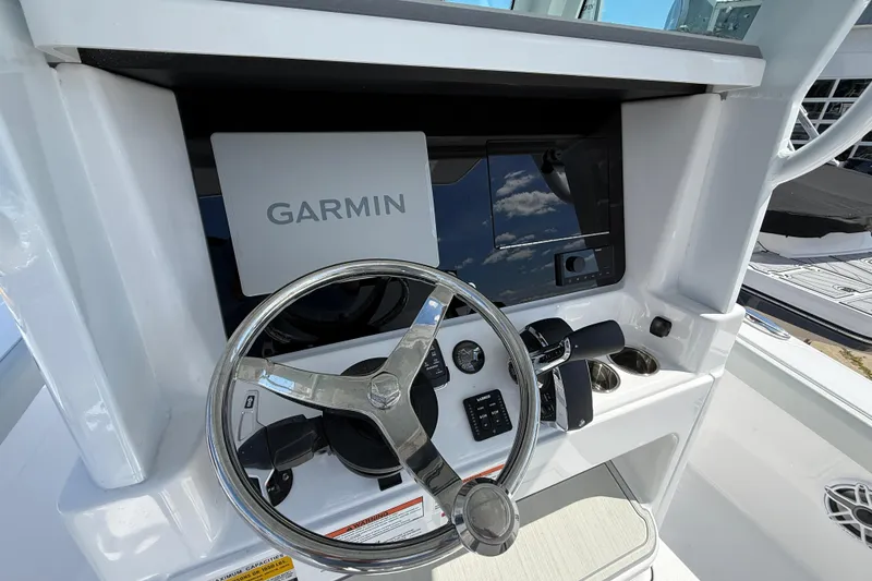 Slide: The Image of Steering console of 2026 Blackfin 242 HB boat with Garmin navigation system. - 14