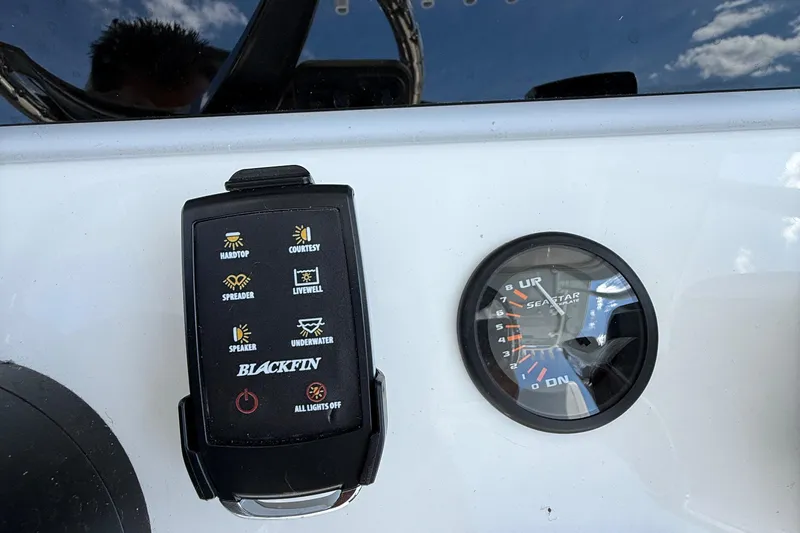 Slide: The Image of Control panel and gauge on a 2026 Blackfin 242 HB boat dashboard. - 15