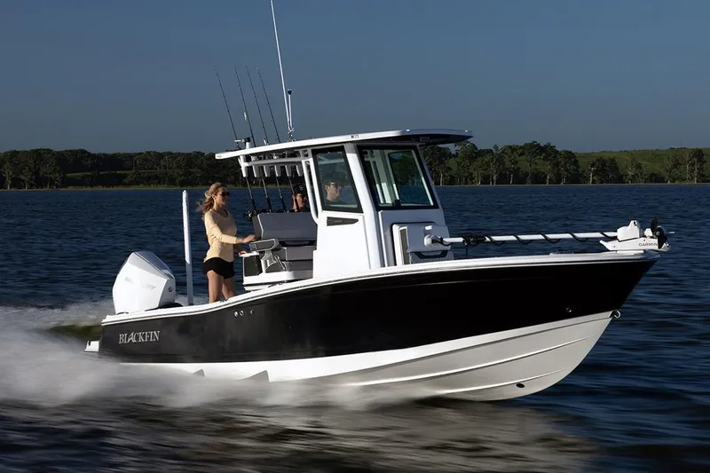 Slide: The Image of Manufacturer Provided Image: 2026 Blackfin 242 HB boat cruising on a lake with two people onboard. - 23