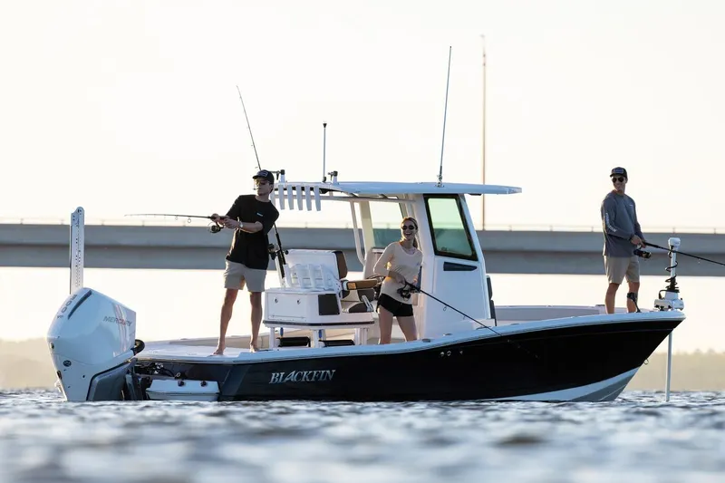 Slide: The Image of Manufacturer Provided Image: 2026 Blackfin 242 HB boat with people fishing on calm water. - 24