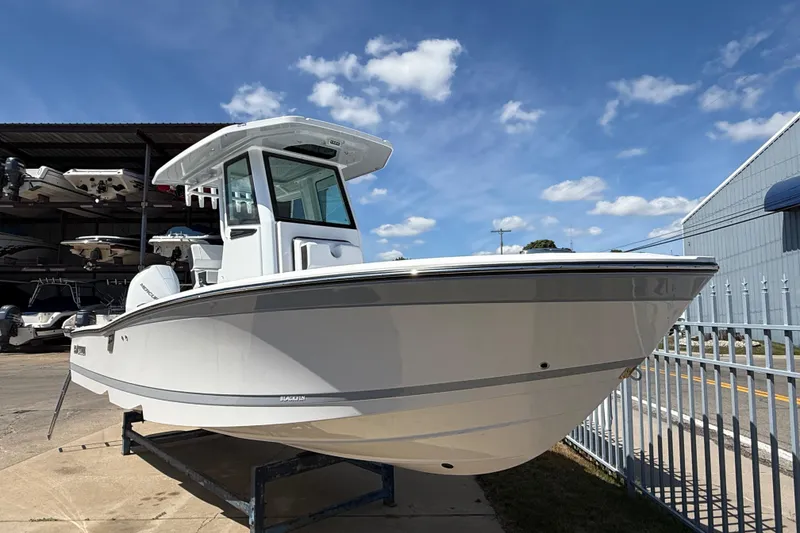 Slide: The Image of 2026 Blackfin 242 HB boat displayed outdoors under a clear blue sky. - 4
