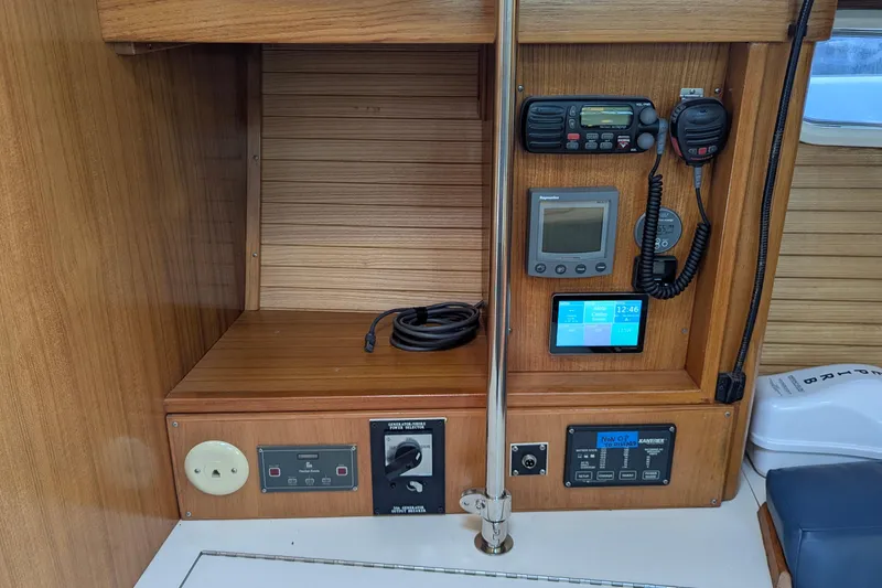 Slide: The Image of 2003 Catalina 42 MkII yacht control panel with navigation and communication equipment. - 22