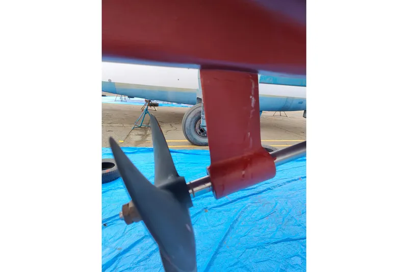 Slide: The Image of Close-up of a 2003 Catalina 42 MkII sailboat propeller and shaft on a blue tarp. - 33