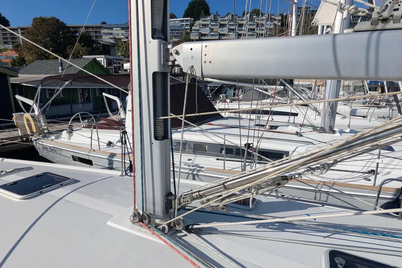 Slide: The Image of 2003 Catalina 42 MkII sailboat docked, showing mast and rigging details. - 8