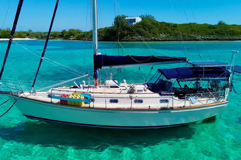 The Image of Sailboat Island Packet 40, 1995 model, anchored in clear turquoise waters. - 0