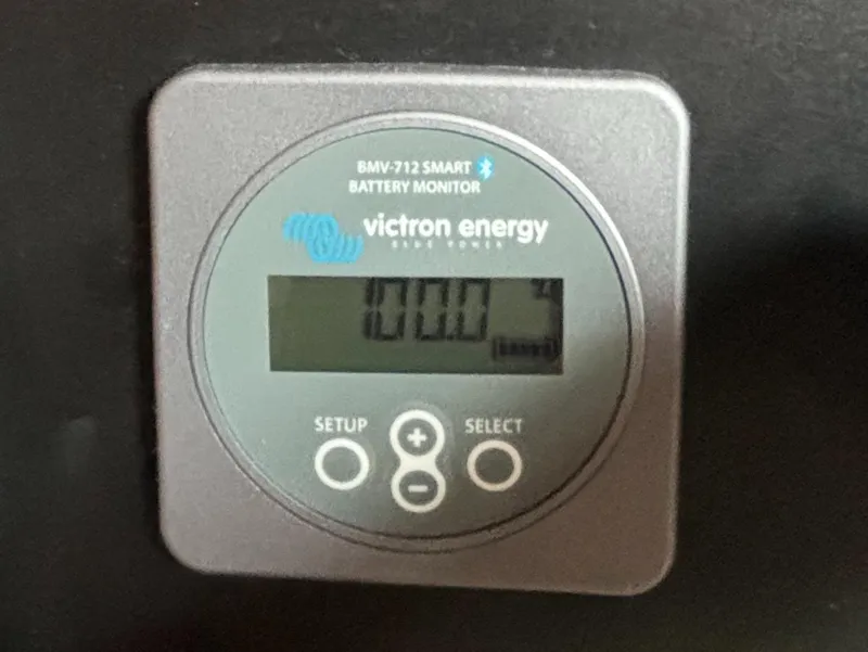 Slide: The Image of Battery monitor display from a 1995 Island Packet 40, showing Victron Energy BMV-712 Smart. - 27