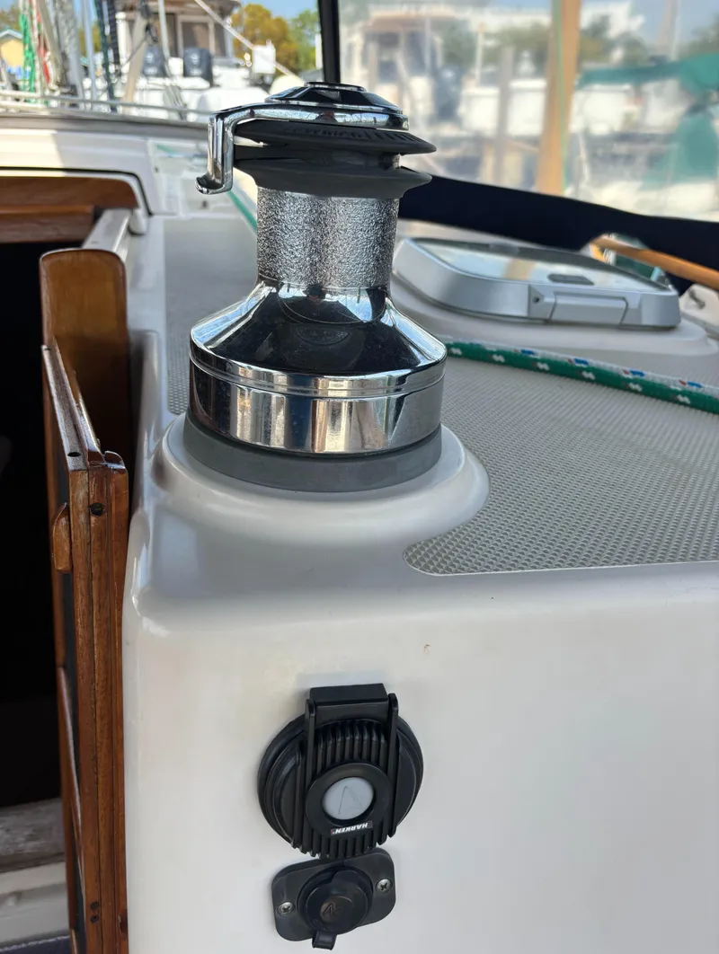 Slide: The Image of Winch on 1995 Island Packet 40 sailboat deck, with rope and control panel. - 46