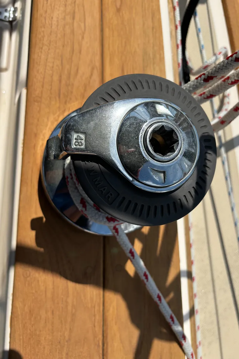 Slide: The Image of Winch on 1995 Island Packet 40 sailboat deck with rope. - 48