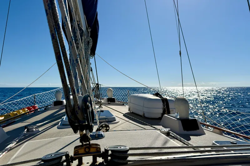 Slide: The Image of Sailing on a 1995 Island Packet 40 yacht under clear blue skies. - 51