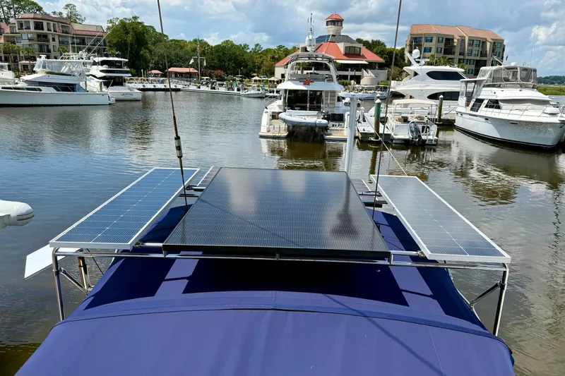 Slide: The Image of Sailboat with solar panels docked in a marina, Island Packet 40, 1995 model. - 55