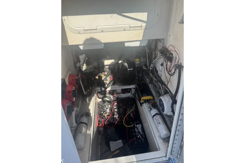 Slide: The Image of Electrical compartment of a 2005 Contender 31 Open boat, showing wiring and components. - 5