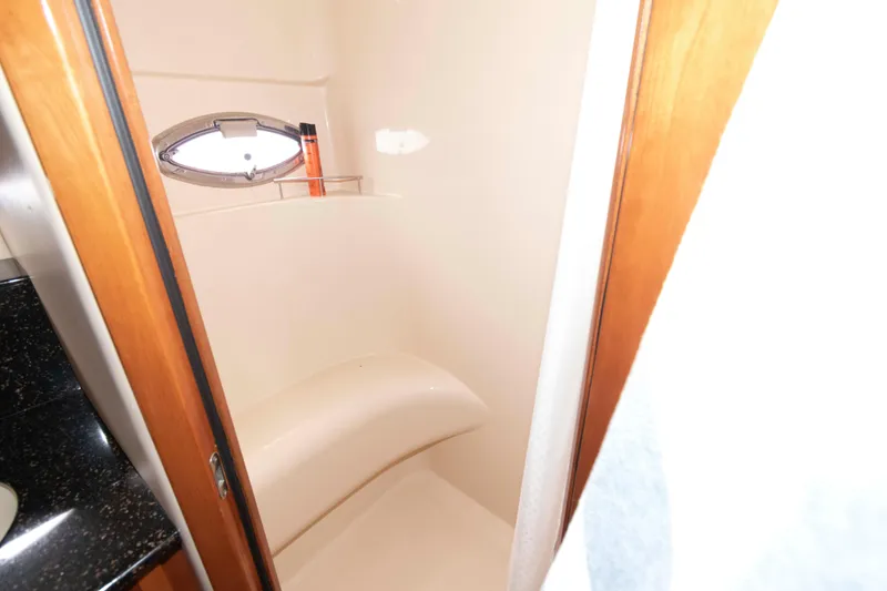 Slide: The Image of Bathroom interior of 2007 Meridian 459 Motoryacht with porthole and shower area. - 19