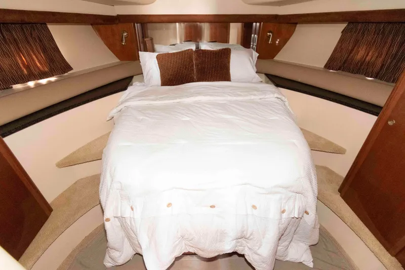 Slide: The Image of Luxurious bedroom interior of 2007 Meridian 459 Motoryacht with cozy bedding and elegant design. - 20