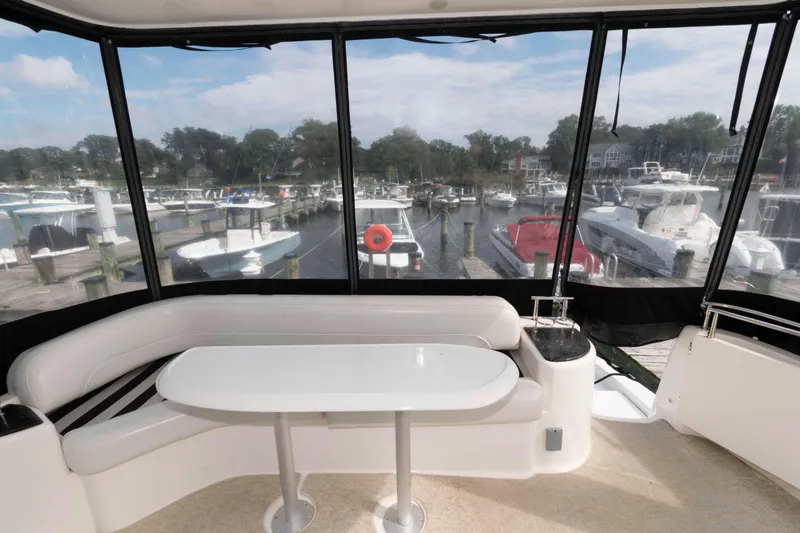 Slide: The Image of 2007 Meridian 459 Motoryacht interior with marina view through large windows. - 5