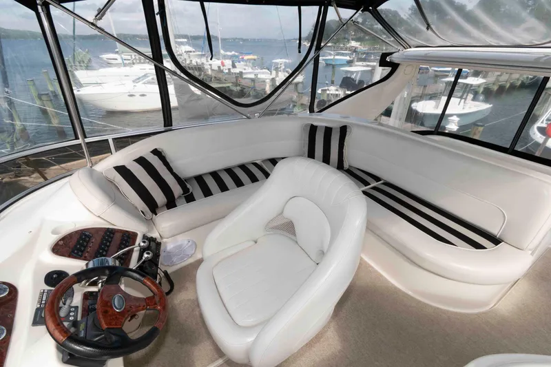 Slide: The Image of Luxurious 2007 Meridian 459 Motoryacht interior with white seating and striped cushions. - 8