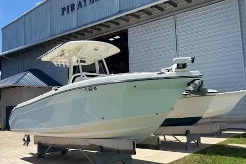 Slide: The Image of 2018 Century 2600 Center Console boat on display outside a large warehouse. - 19