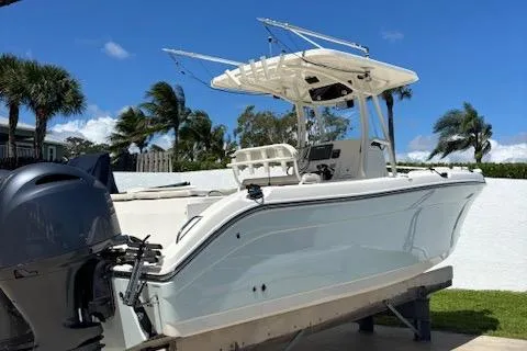 Slide: The Image of 2018 Century 2600 Center Console boat on trailer, with clear blue sky background. - 20