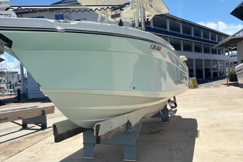 Slide: The Image of 2018 Century 2600 Center Console boat on a dock, side view. - 29