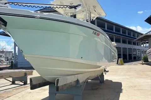 Slide: The Image of 2018 Century 2600 Center Console boat on display at a marina. - 30