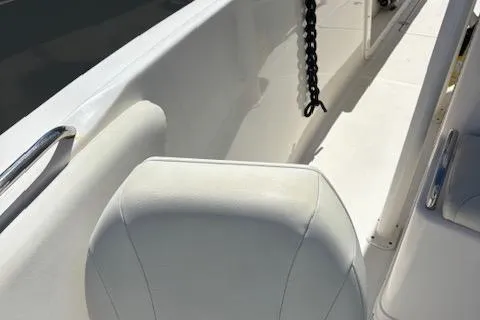 Slide: The Image of 2018 Century 2600 Center Console boat interior with white seating and chain detail. - 32