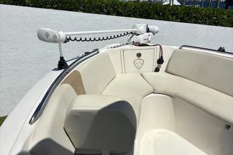Slide: The Image of 2018 Century 2600 Center Console boat with cushioned seating and mounted equipment. - 33