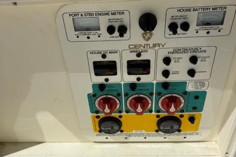 Slide: The Image of Control panel of a 2018 Century 2600 Center Console boat with various switches and meters. - 37