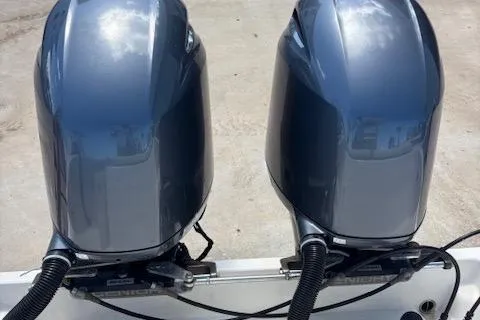 Slide: The Image of Twin outboard motors on a 2018 Century 2600 Center Console boat. - 4