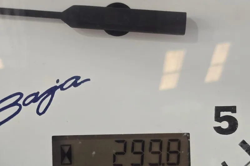 Slide: The Image of Close-up of a 1997 Baja 322 gauge displaying 299.8, with signature logo. - 24