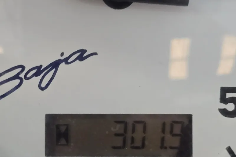 Slide: The Image of Close-up of a 1997 Baja 322 gauge displaying "3019" with Baja logo. - 25