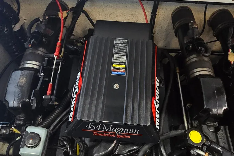 Slide: The Image of Engine of a 1997 Baja 322 boat featuring a MerCruiser 454 Magnum with Thunderbolt ignition. - 31