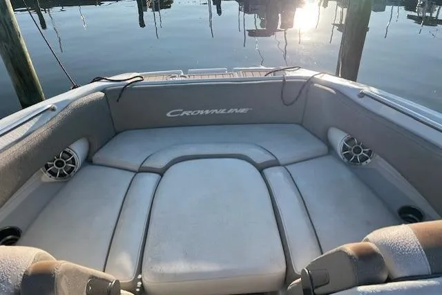Slide: The Image of 2018 Crownline Eclipse E23 XS boat bathroom with sink, faucet, and porthole window. - 11