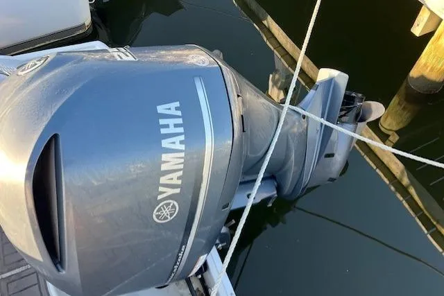 Slide: The Image of Yamaha outboard motor on 2018 Crownline Eclipse E23 XS boat, docked in water. - 20