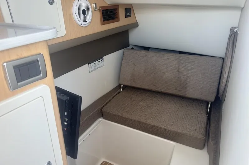 Slide: The Image of Interior cabin of 2021 World Cat 320 DC with seating and electronic controls. - 22