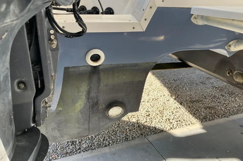 Slide: The Image of 2021 World Cat 320 DC boat hull detail with visible fittings and components. - 32