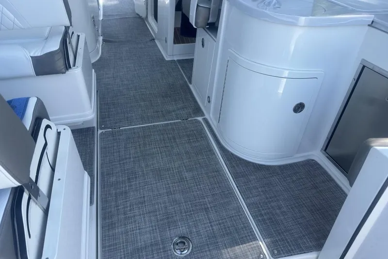 Slide: The Image of Interior of 2021 World Cat 320 DC boat with sleek seating and modern flooring. - 20